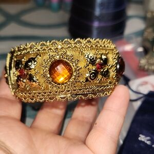 Gold-Tone Ornate Cuff Bracelet with Amber Color Cabochons